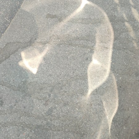 Light on a sidewalk, rue Larrey, Paris - photo by William Eaton, 2025